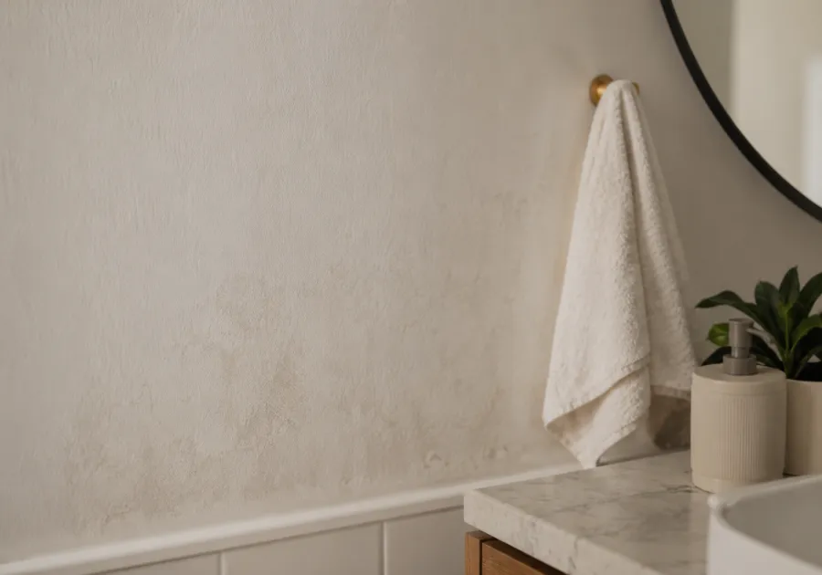 A bathroom wall showing early signs of hidden moisture damage
